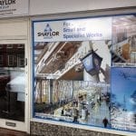 A close up of a shop front that has window film installed