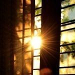 Sun shining through a gap in the blinds
