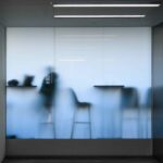 Frosted glass with meeting behind